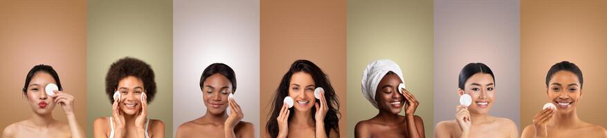 A group of women with varying skin tones are shown cleansing their faces with cotton rounds. They are all smiling and appear to be enjoying the process. The background consists of solid color panels. photo