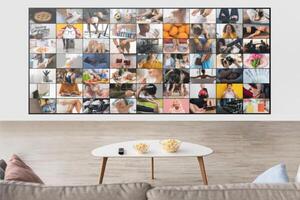 This image shows a modern living room with a television screen displaying a multitude of small images, each showcasing different scenes of everyday life, lifestyle activities, and personal interests photo