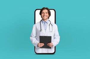 A young doctor delivers a virtual healthcare consultation, depicted within the blank screen of a smartphone, in a sleek medical environment. photo