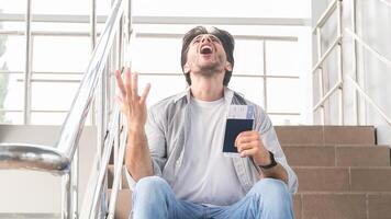 Lost Flight. Desperate Man Sitting In Airport With Passport, Border Closed Due To Coronavirus, Guy Emotionally Yelling Why, Panorama With Free Space photo