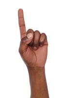 Black hand shows number one isolated. Counting gesturing, enumeration, white background photo