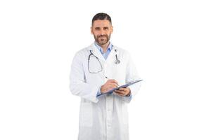 A man doctor is standing in a medical office, wearing a white lab coat and a stethoscope around his neck, writing on a clipboard, white background photo