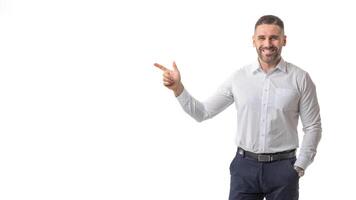 A smiling man dressed in business attire points confidently with his index finger against a clean, white background. The man exudes a professional yet approachable demeanor, copy space photo