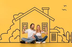 A man and a woman are seated on the floor, facing a large drawing of a house on a piece of paper. They appear to be studying the detailed features of the architectural design. photo