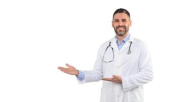 A man doctor, wearing a white lab coat and stethoscope, confidently gestures towards his right. He appears friendly and approachable, panorama with copy space photo