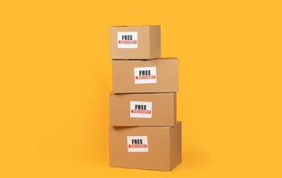 Four identical boxes with free delivery text are arranged vertically on a vibrant yellow background. The boxes are stacked neatly on top of each other photo