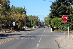 Intersection with Stop sign. Photo on a sunny day