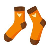 A pair of cozy yellow socks with a heart. Winter and autumn warm wool socks. Design element on a white background. vector