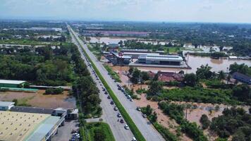 Aerial view of a paved expressway in Chiang Mai. Many passenger cars are commuting in freeway in the morning. video