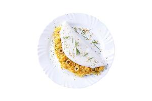 homemade tapioca or beiju stuffed with boiled chicken and olives isolated on white background photo