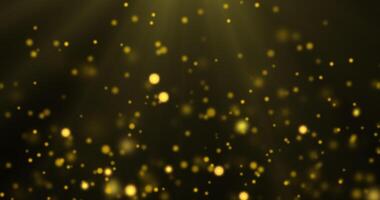 Golden luxury bokeh on particles floating in the air. Dust and glitter particles background. Black background , Use blending mode screen. Loop Animation video