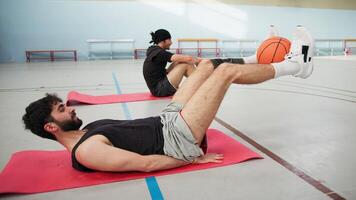 Boy Does Lower Abs Exercises In The Gym Lying On The Ground video