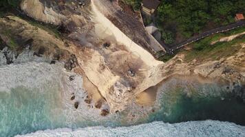 Escalators destroying the rock near Uluwatu temple. Aerial drone view video