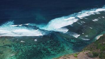 Ocean with waves and largest rip current. Drone view of scenic seascape in Bali video