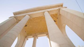 High columns of Porta Ticinese against clear blue sky video