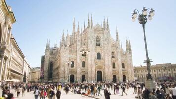 People walk on crowded square against Duomo cathedral video