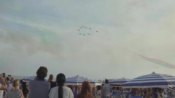 Italy, Jesolo - August 2022. Planes fly in the sky making shows video