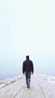Man walks on the dike with fog video