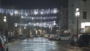 Chioggia, December 2022. Empty street at night with cars parked on the sides video