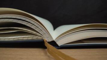 Notebook with thin white pages and bookmark lying on table video