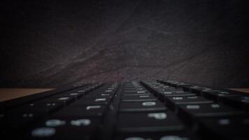 White letters and numerals on buttons of black keyboard video