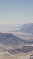 An aerial view of a mountain range in the desert video