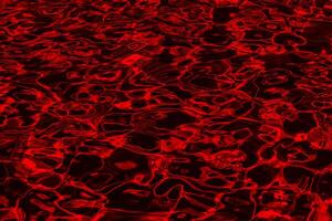 A red and black background with many black and red shapes photo
