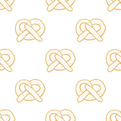 Seamless pattern with hand drawn pretzels on white background. Design for wrapping paper, textile, wallpaper. Oktoberfest concept