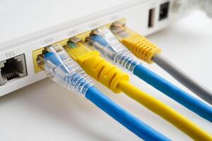Ethernet cable with wireless router connect to internet service provider network. photo
