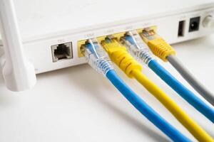Ethernet cable with wireless router connect to internet service provider network. photo