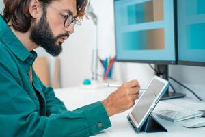 Man working with computer digital tablet at modern office. photo