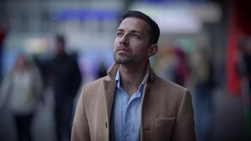 A Pensive Man in an Urban Setting with a Deeply Contemplative Expression on His Face video