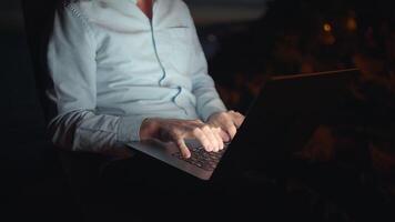 Engaging in a Work Session at Night on a Laptop Surrounded by Soft Ambient Light for Focused Tasks video