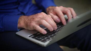 Closeup of hands typing on a laptop, highlighting business productivity in a modern workspace video
