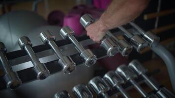 A CloseUp View of Dumbbells in an Engaging and Dynamic Gym Setting for Fitness Enthusiasts video