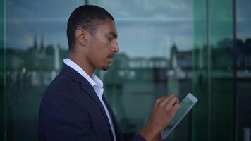 A Business Professional Engaged in Activities Using a Digital Tablet Within a Modern Office Space video