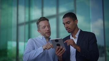Engaging in a Collaborative Business Meeting Utilizing a Tablet in a Modern Office Space video