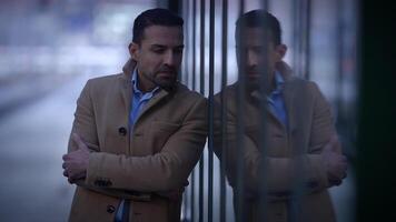 A contemplative man is found in a city setting, engaging in deep thought and reflection video