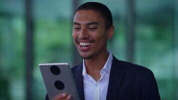A person on a call using a tablet, showing interest and attentiveness in communication video