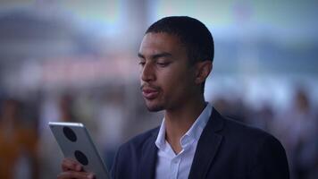 A person on a call using a tablet, showing interest and attentiveness in communication video