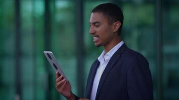 A person on a call using a tablet, showing interest and attentiveness in communication video
