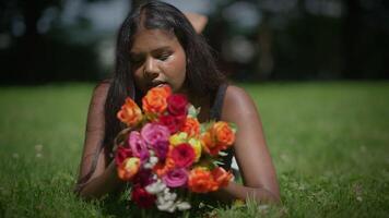 A Woman Holding a Colorful Bouquet While Surrounded by a Lush and Beautiful Outdoor Setting video