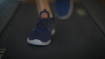 CloseUp View of Feet in Motion During Running on a Treadmill Within a Gym Environment video