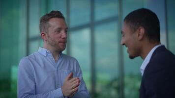 Two Professionals Engaging in a Meaningful Conversation in a Modern Office Environment video