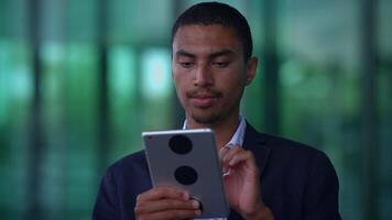 A person on a call using a tablet, showing interest and attentiveness in communication video