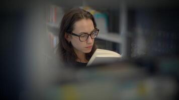 A Focused Reader Immersed in the Practice of Reading Within a Modern Library Environment and Setting video