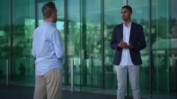 An Engaging and Professional Business Meeting Set Against a Backdrop of Modern Architecture video