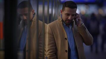 Urban Conversation at Dusk A Man Engaged in a Phone Call While in the Cityscape Setting video