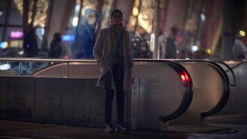 An Urban Night Scene captures the dynamic essence featuring an Escalator and a Waiting Figure video