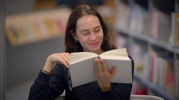 A Joyful Reader Inside a Library Fully Engaged in a Wonderful Book Exploration Journey video